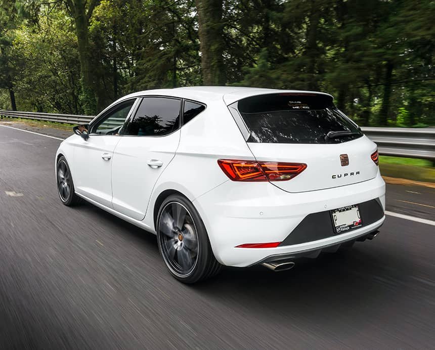 White Car Driving on Road White Car Driving on Road